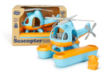 Green Toys Seacopter in packaging, next to a second, unpackaged Seacopter (Color: Light Blue & Orange) (Front View with included Bear Aviator Toy standing beside the Seacopter)