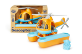 Green Toys Seacopter in packaging, next to a second, unpackaged Seacopter (Color: Orange & Light Blue) (Front View with included Bear Pilot Toy standing beside the Seacopter)